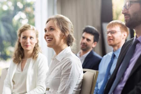 woman-sitting-public-smiling